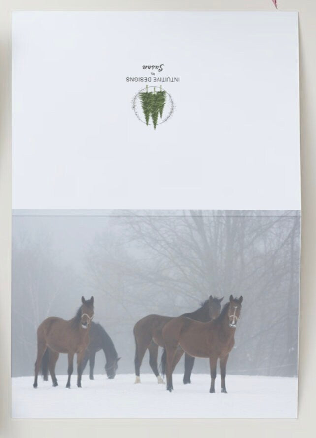 Christmas card featuring horses in a snowy background