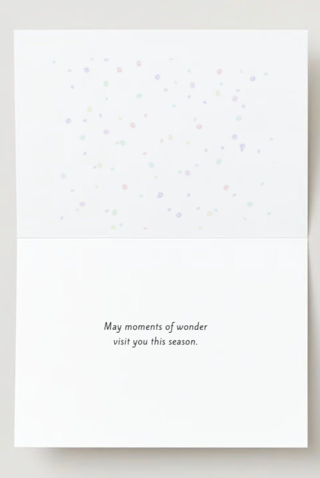 Christmas card featuring horses in a snowy background